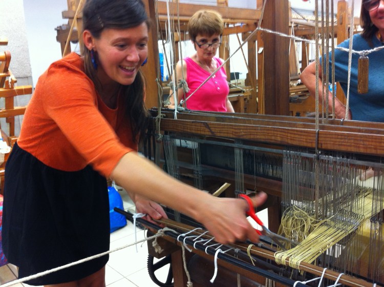 Amy Ilic eagerly removes her first ikat weaving