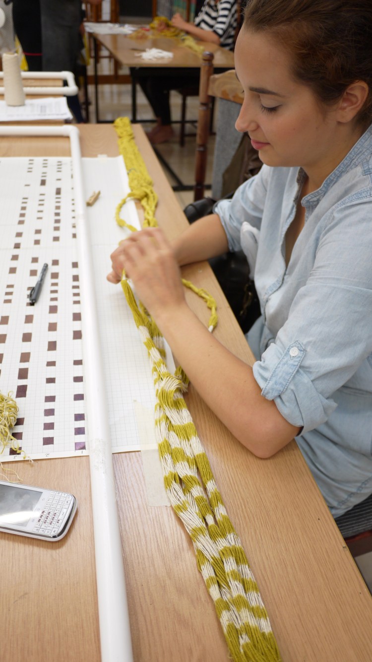 Dominika Zietek removes the last bindings from her warp