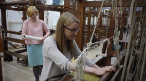 Working as a team, Katarzyna Sojka weaves up the warp that Dominika Zientek designed the previous week. The looms she is weaving on was once in one of the many weavings mills that populated the city.