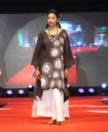 Jenifer Homi models her original design. Stitched and bound resist.