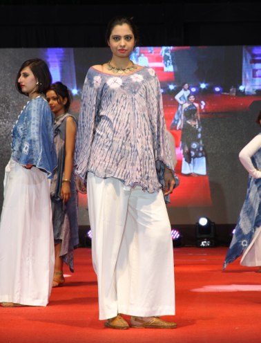 Bound resist disks top this flowing wood grain cover up by Ankita Patadiya.